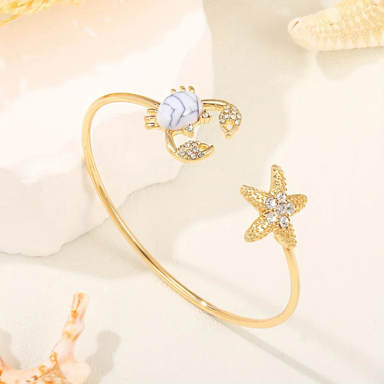 Bague crabe réglable dorée avec perle double