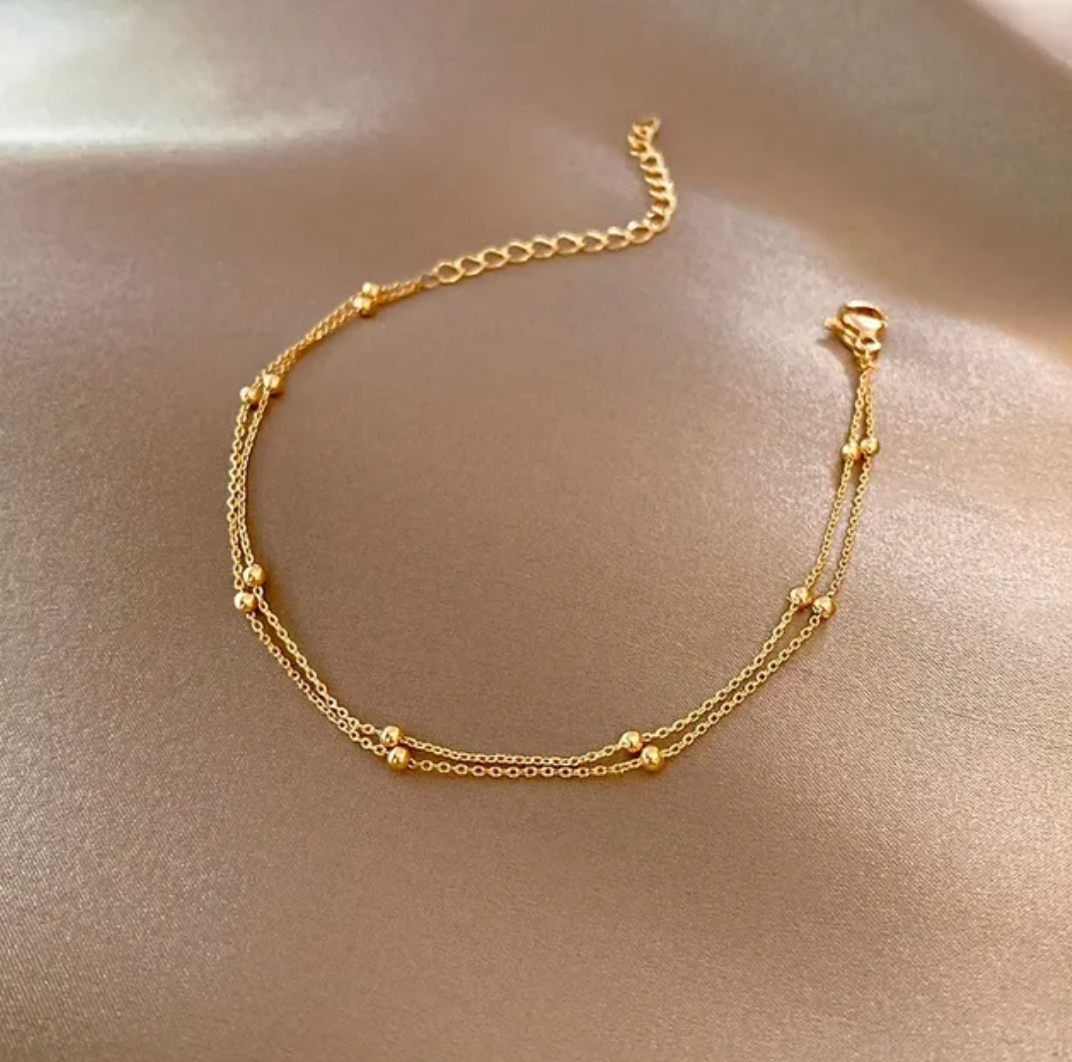 Beau double bracelet doré avec perles