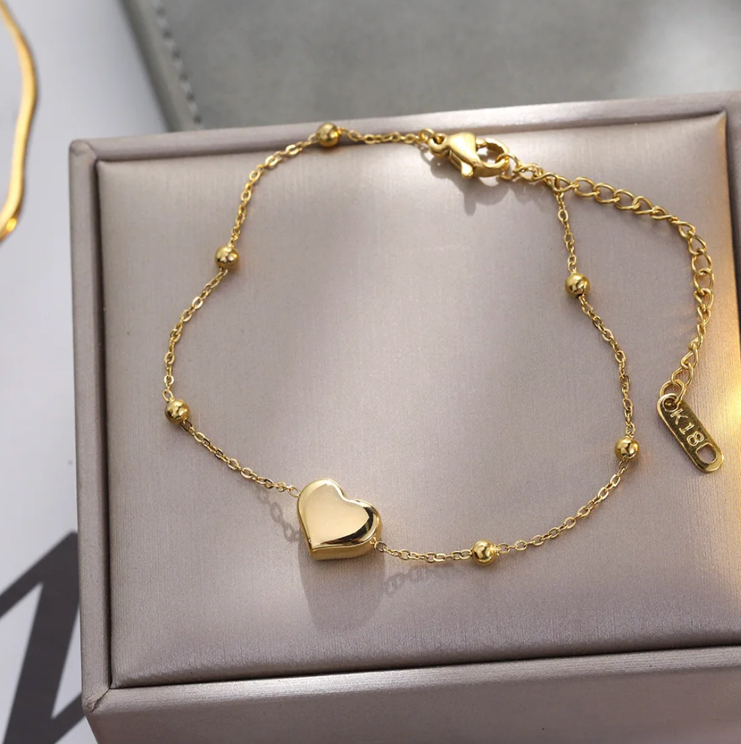 Bracelet cœur solide et perle doré