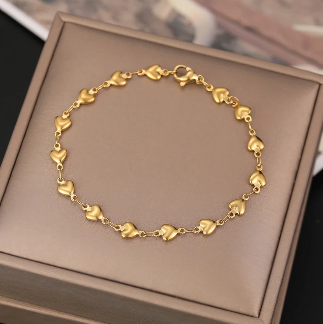 Bracelet petits cœurs multiples doré
