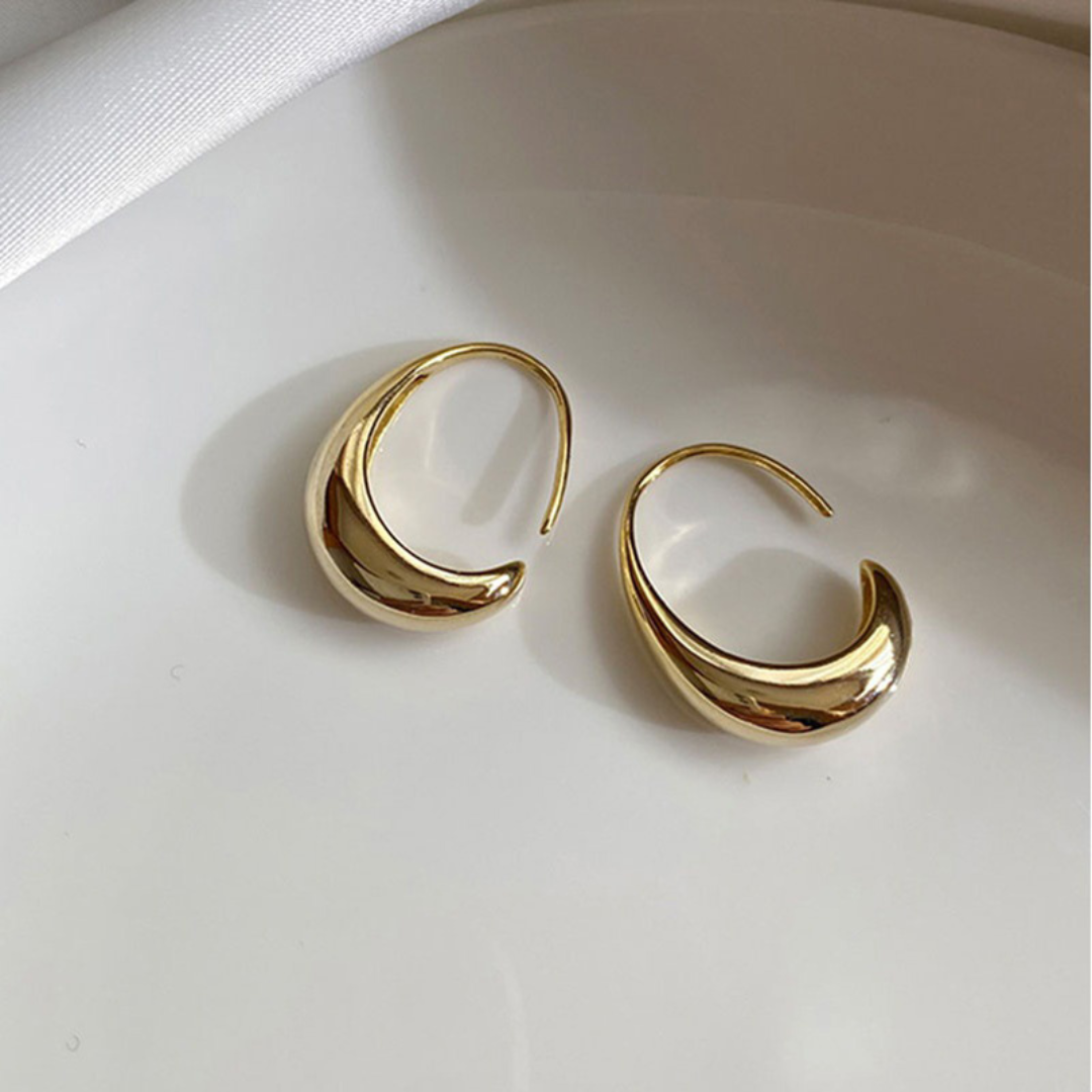 Boucles d'oreilles modernistes scintillantes dorées