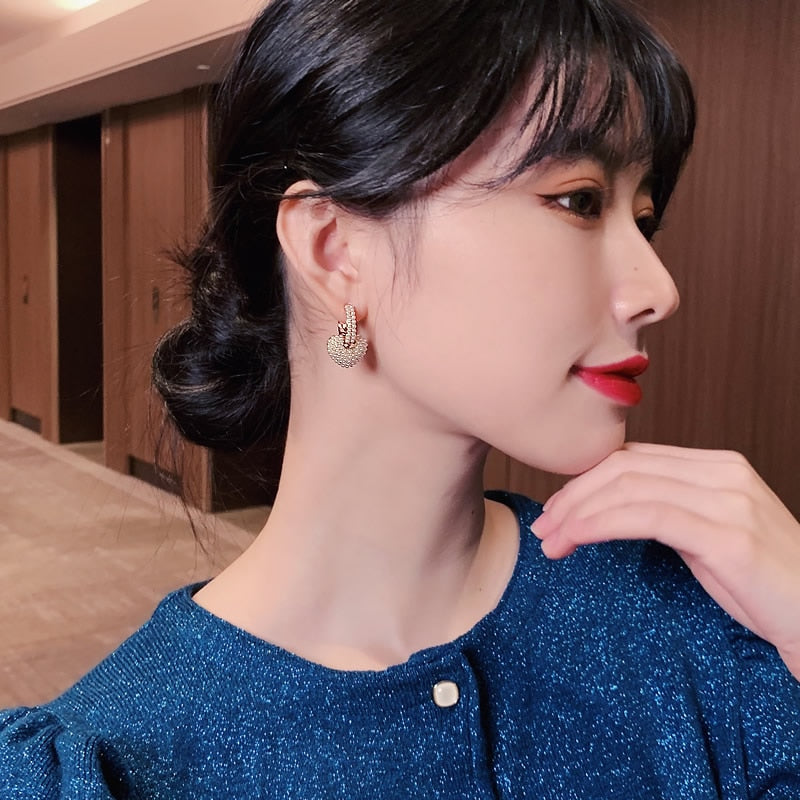 Boucles d'oreilles amour en perle dorées