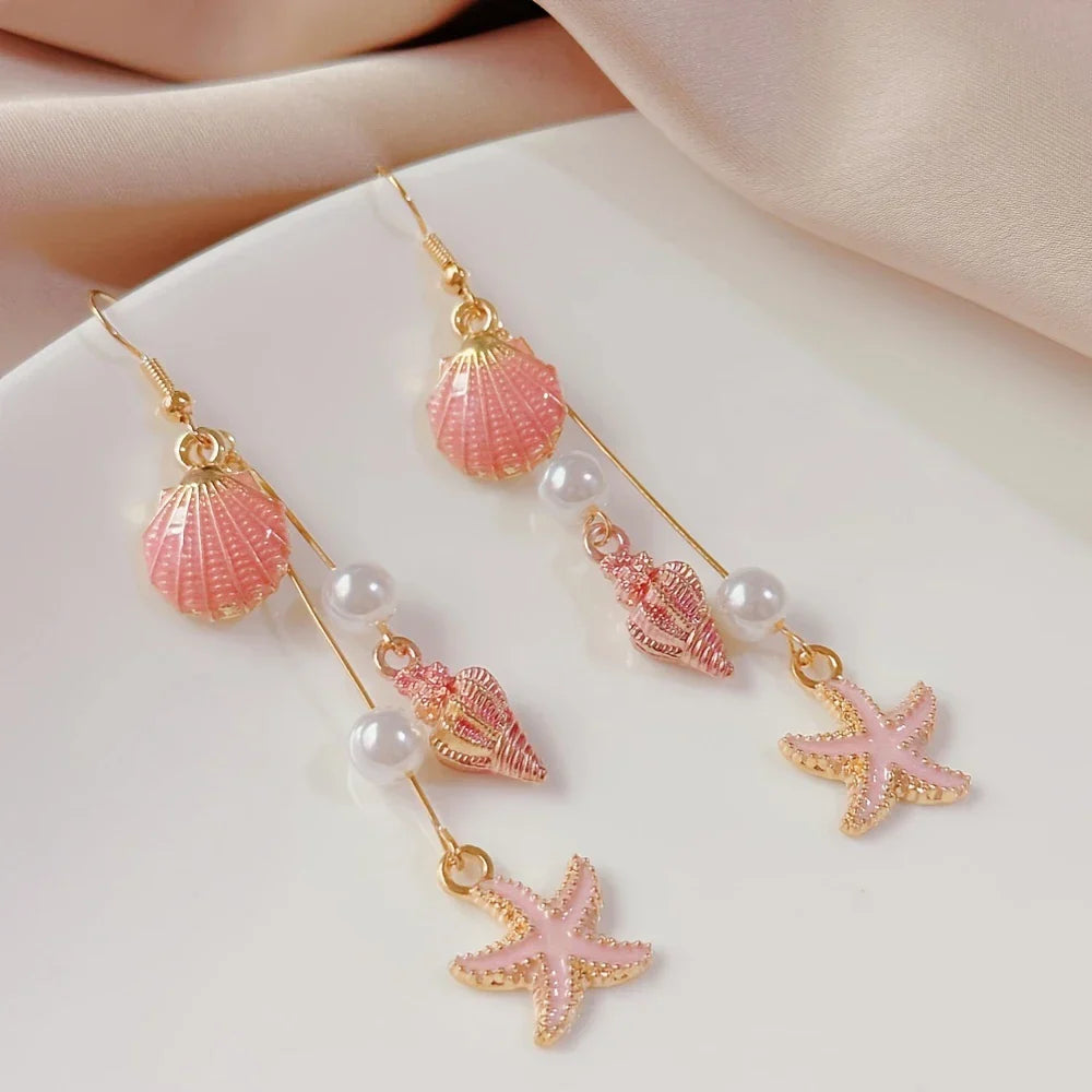 Boucles d'oreilles élégantes coquille, étoile et conque marine