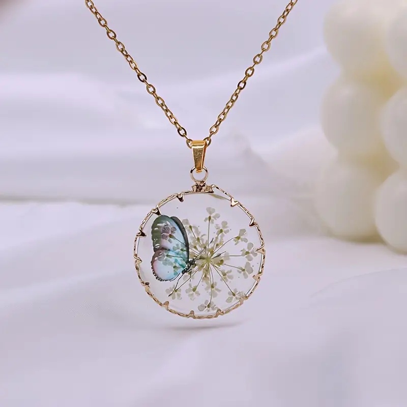 Collier papillon floral doré