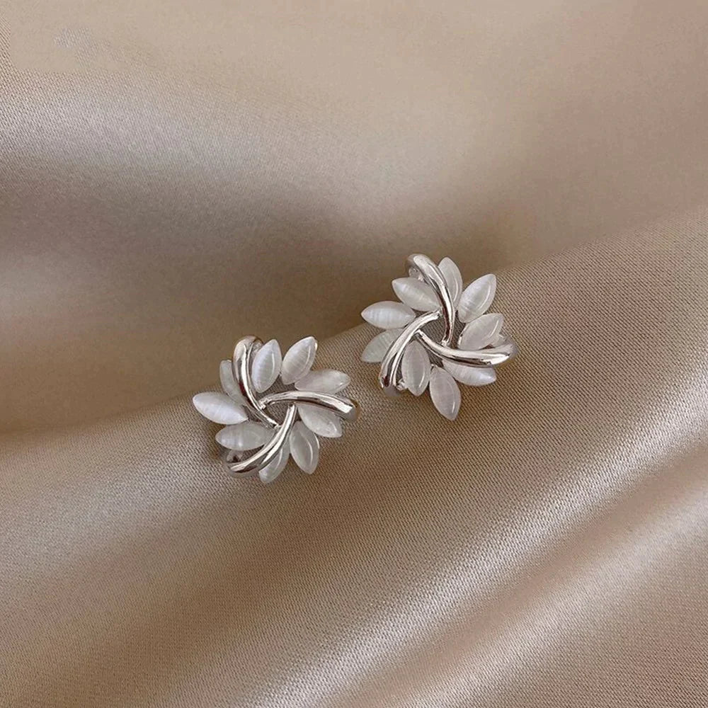 Boucles d'oreilles élégantes en écrou dorées et argentées