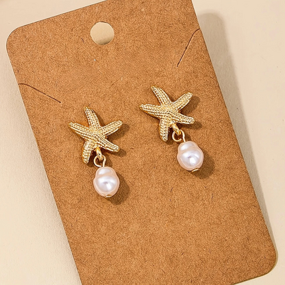 Boucles d'Oreilles Étoile de Mer avec Pompon de Perle Élégante