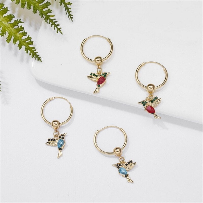 Boucles d'oreilles colibri volant édition limitée avec zircone cubique double