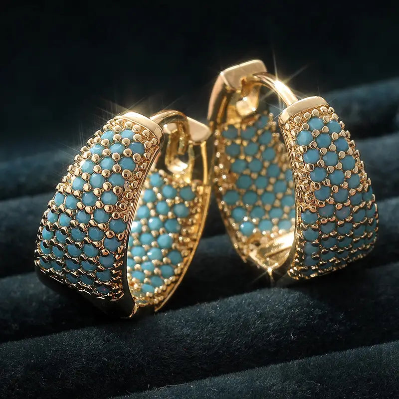 Boucles d'oreilles créoles en perle turquoise dorées Dorées